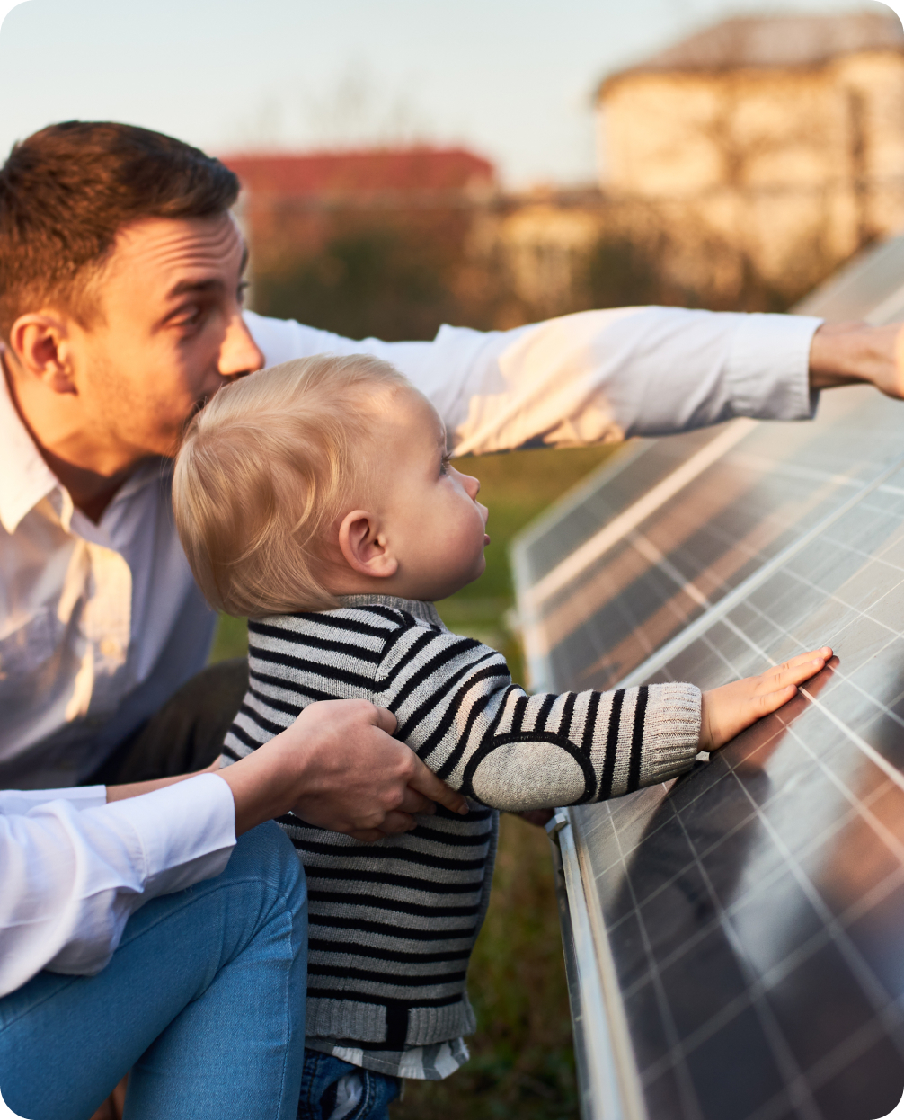Father and Son looking and touching a solar panel.