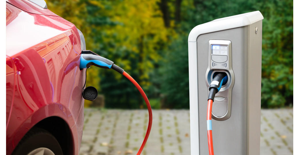 Electric car plugged in charging