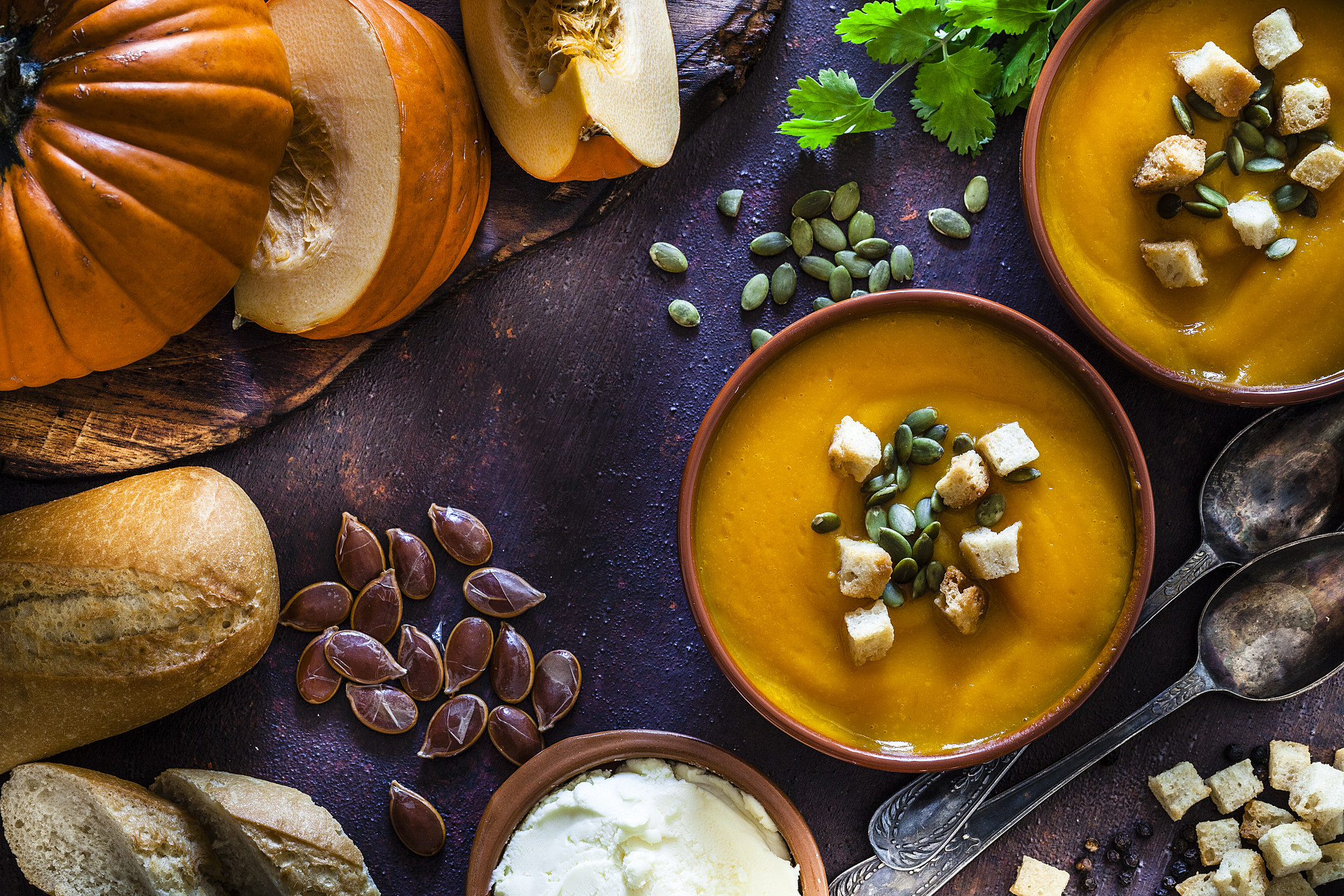 A spread of fall foods such as pumpkin soup.