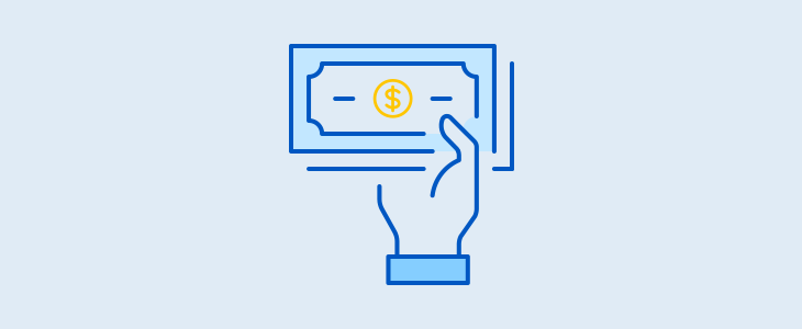A hand holding money, symbolizing payment or cash exchange.