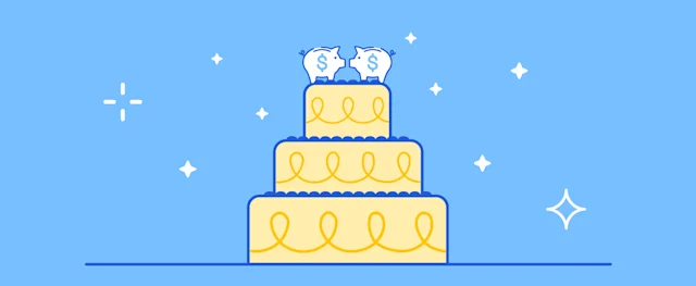 A wedding cake with piggy banks on top, symbolizing wedding costs.