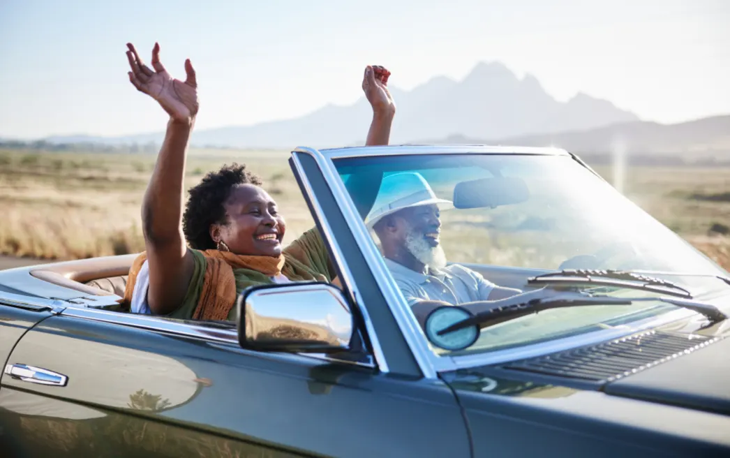 Couple riding in their newly refinanced car