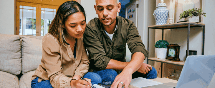 Man and woman looking over their finances