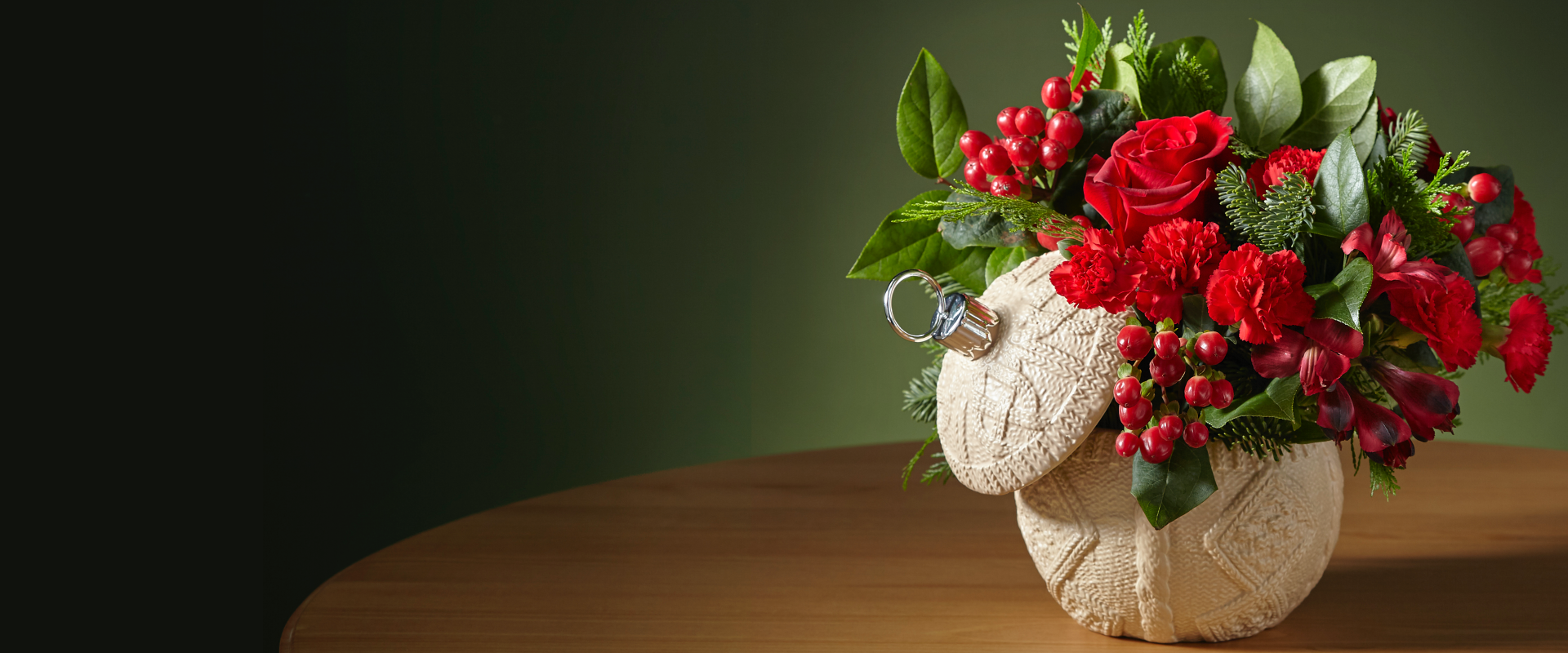 Image of Christmas bouquet in a bulb shaped vase