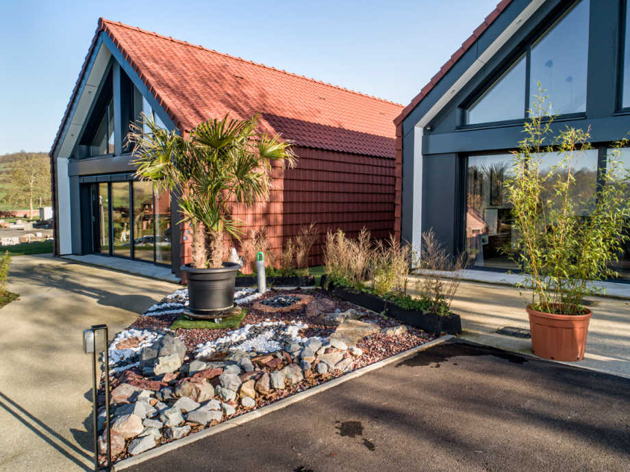 Photographie de maisons avec façade en bardage. Photo prise par le photographe Laurent-Blossier.