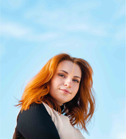 Person with Ginger Hair with a sky background
