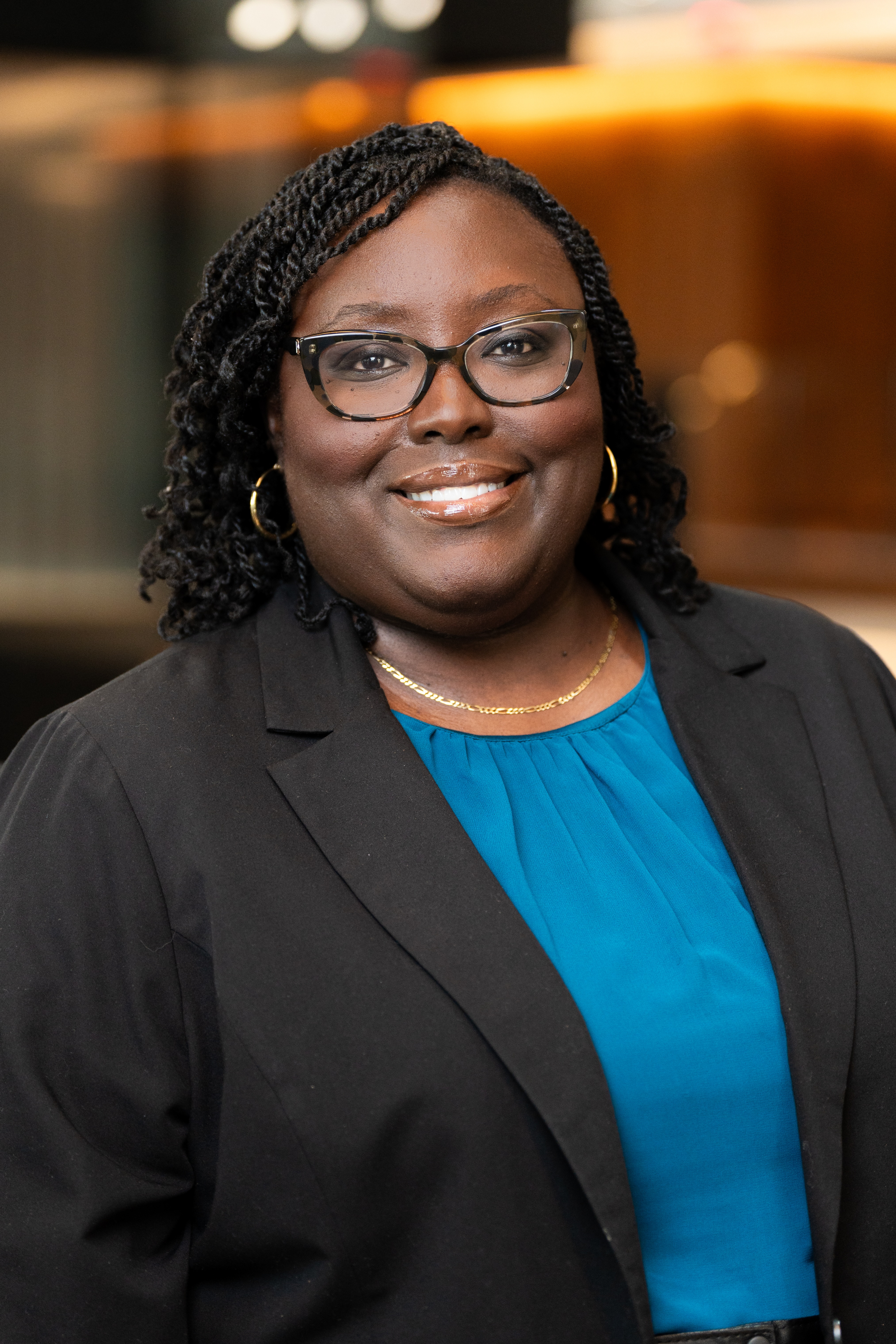 Portrait of Tené Traylor, Executive Director of COWD