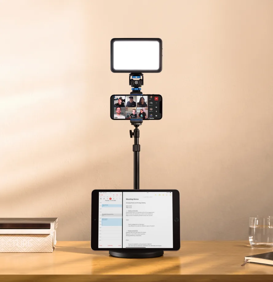 Using a smartphone attached to Mini Mount for a Zoom call with an iPad placed in the Mini Mount slotted base