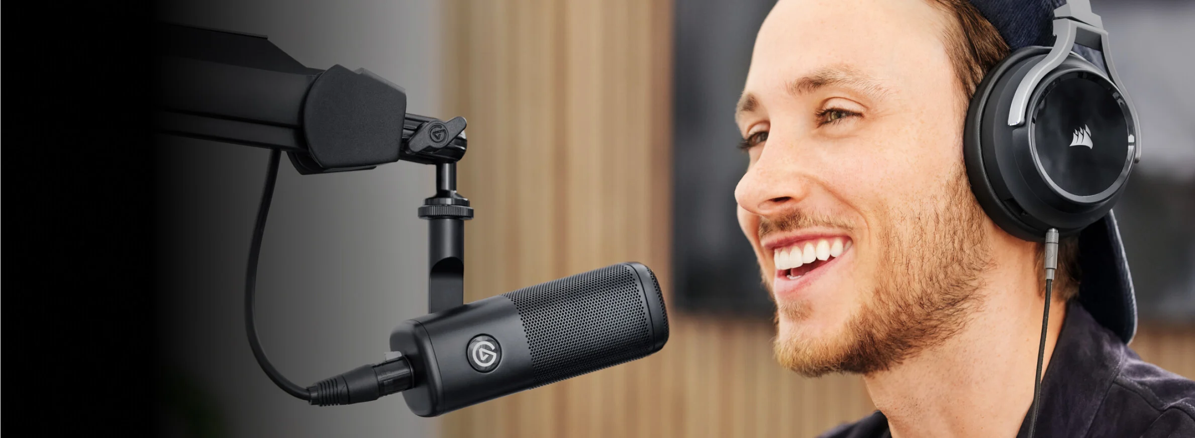 Podcasting creator laughs into wave dx dynamic mic