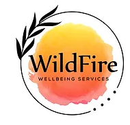 The logo for WildFire Wellbeing Services features the company name in bold black letters centered over a circular watercolor background in shades of yellow, orange, and pink. The design is encircled by a black ring with a leafy branch on the left side and three small dots on the lower right.