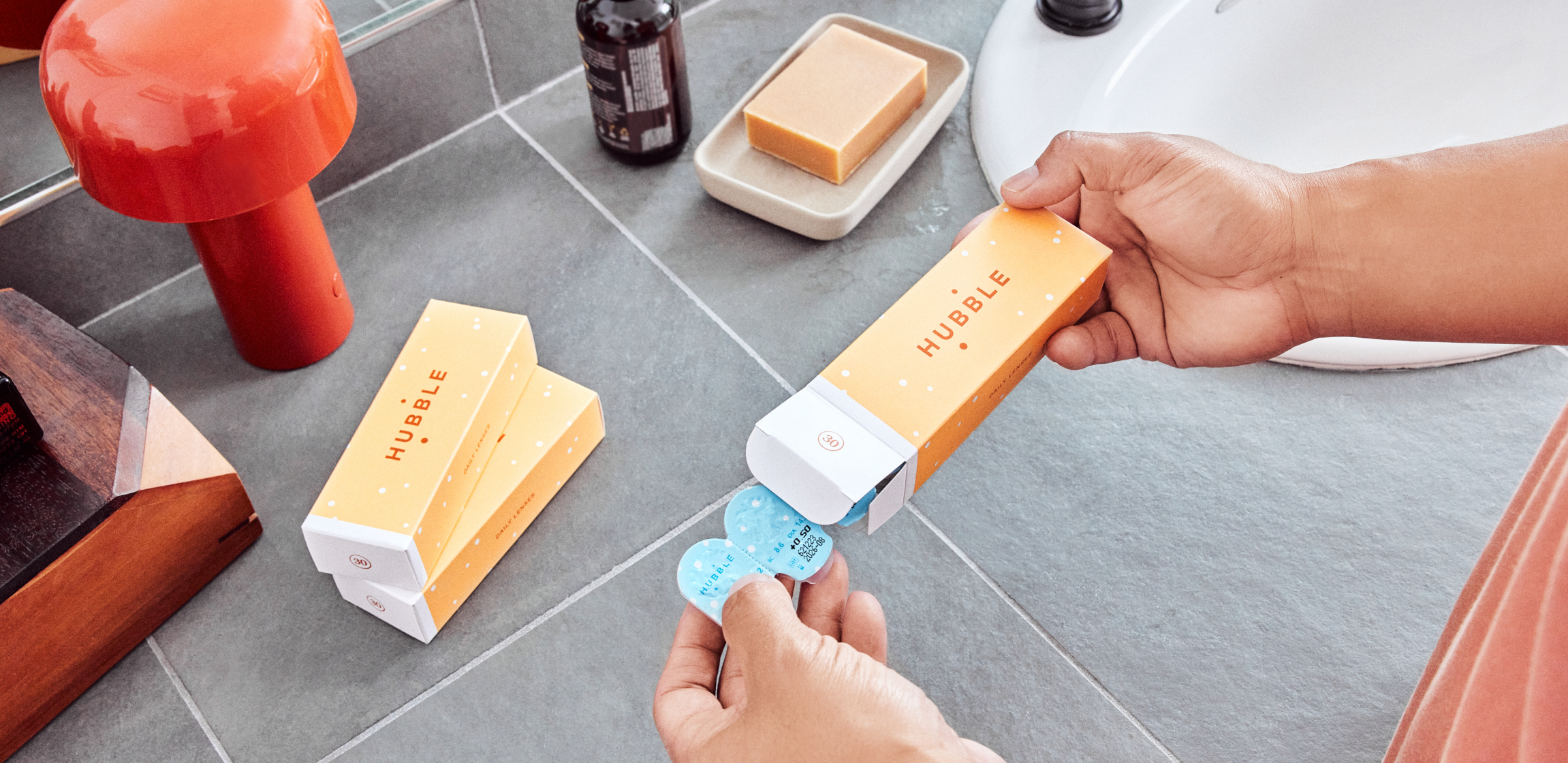 Woman unboxes her Hubble contacts