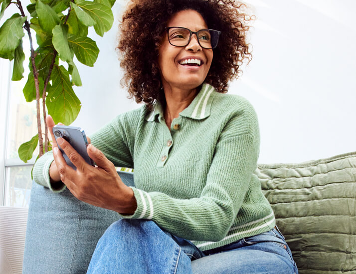 Happy woman wearing her Hubble eyeglasses