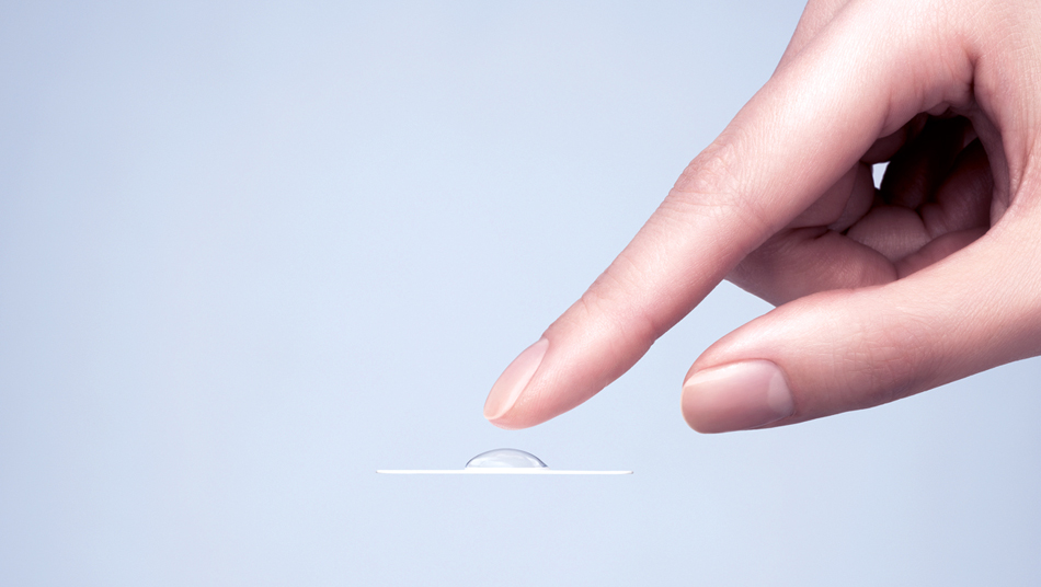 A hand reaches for a Hydro by Hubble contact lens
