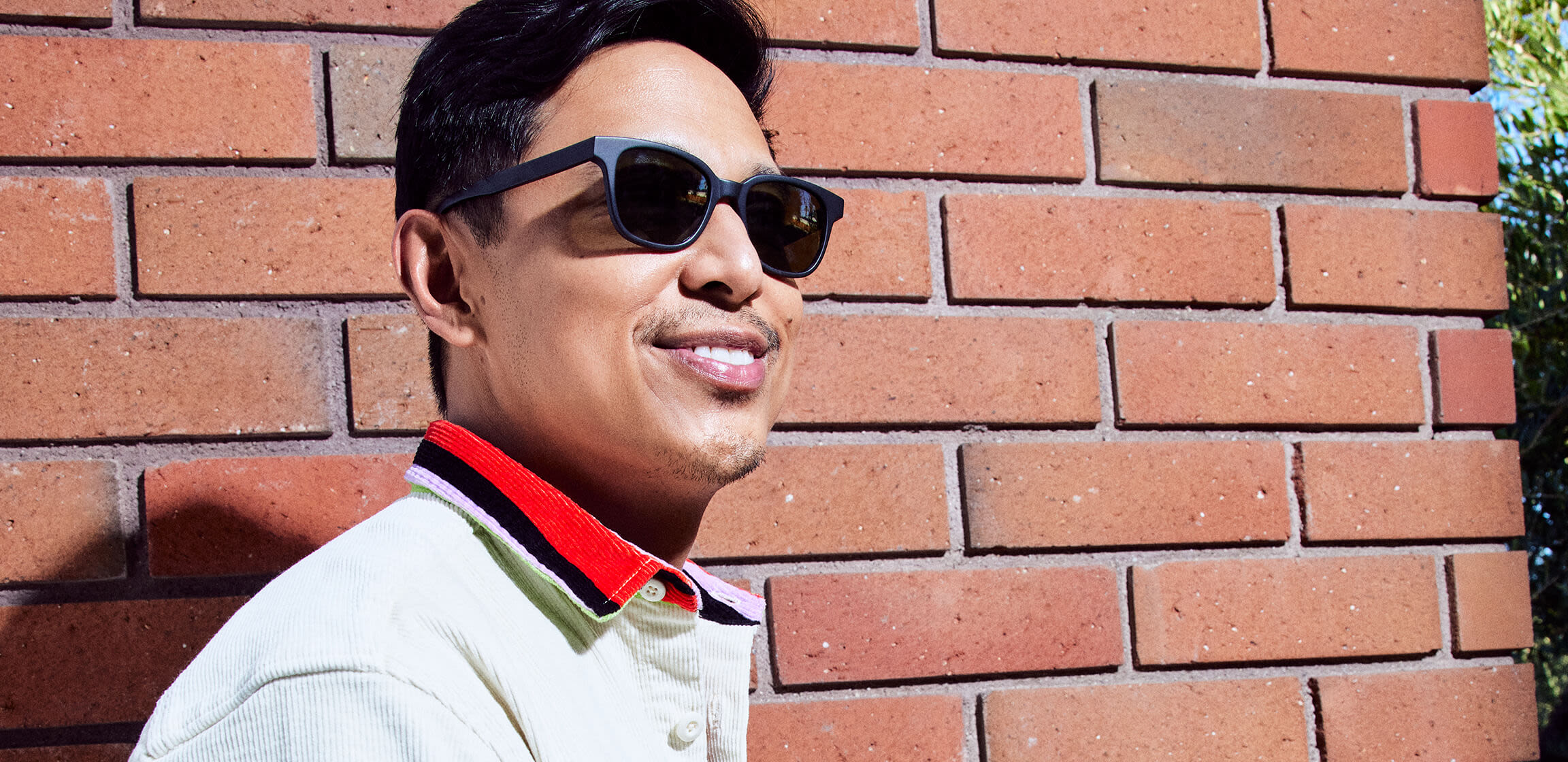 Smiling man wearing Hubble sunglasses