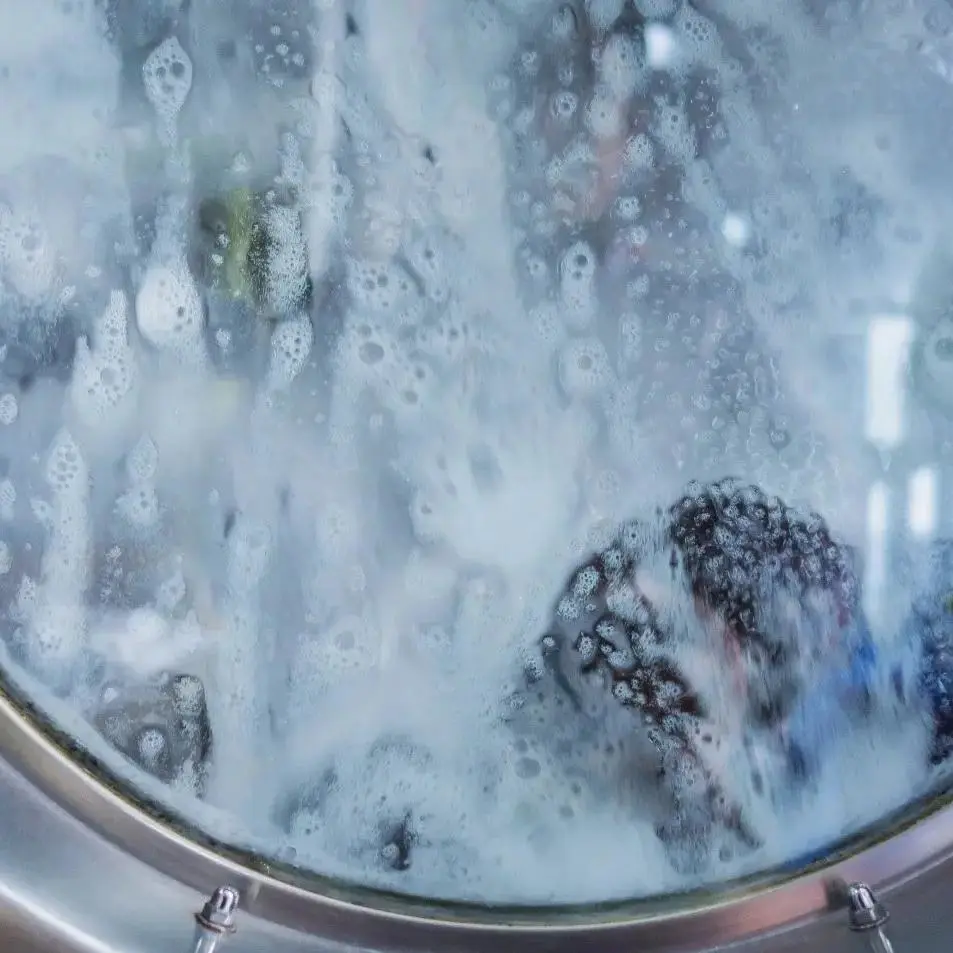 A close-up of a working laundry machine