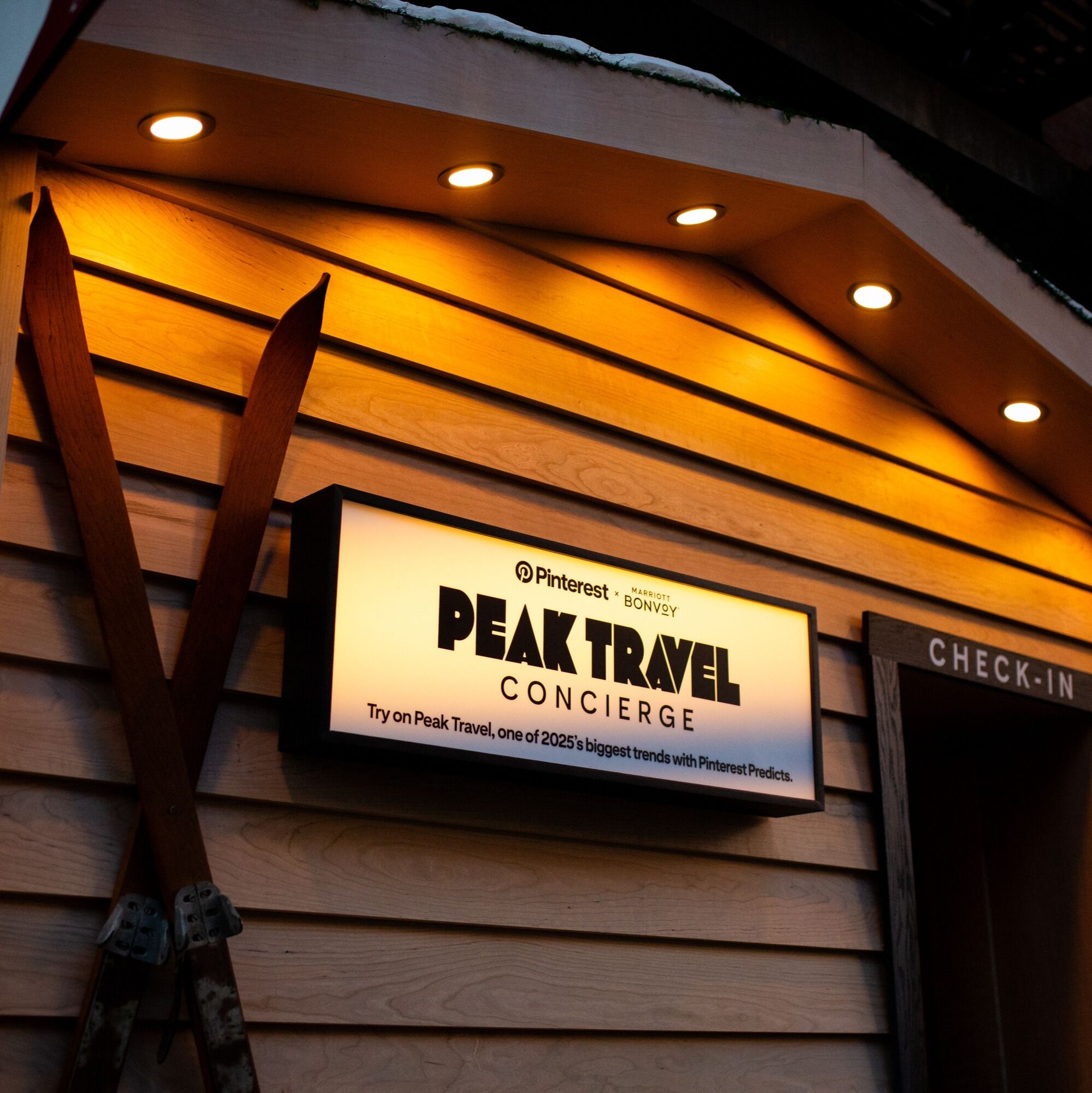 Cabin with Peak Travel sign