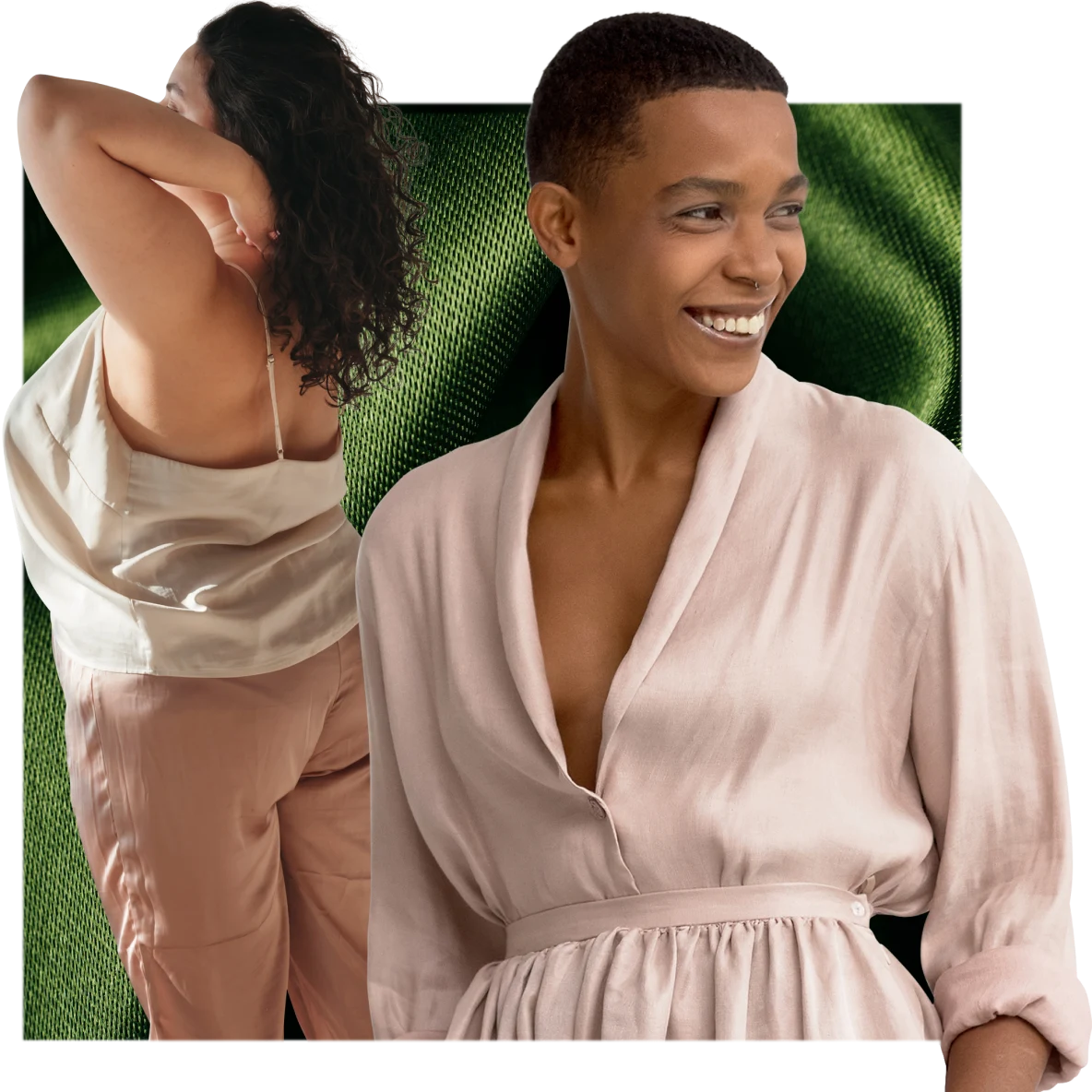Two Black women, one with short hair and one with long hair, are wearing pink nightclothes and standing in front of a green linen backdrop.