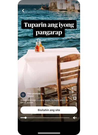 Thumbnail ng preview ng idea ad na nagpapakita ng hapag-kainan na may tanawing dagat pinamagatang “Tuparin ang pangarap mo” na may button na “Bisitahin ang site” na nasa gitnang bahagi sa ibaba.