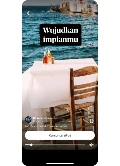 Gambar mini pratinjau iklan ide menampilkan meja makan dengan pemandangan tepi laut berjudul “Wujudkan impianmu” dengan tombol “Kunjungi situs” di bagian tengah bawah.