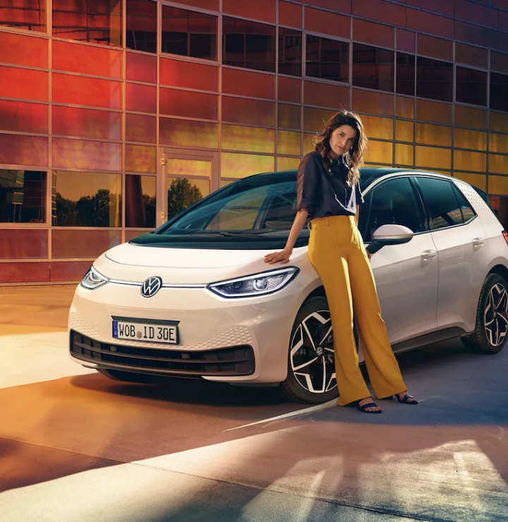 woman leaning on car