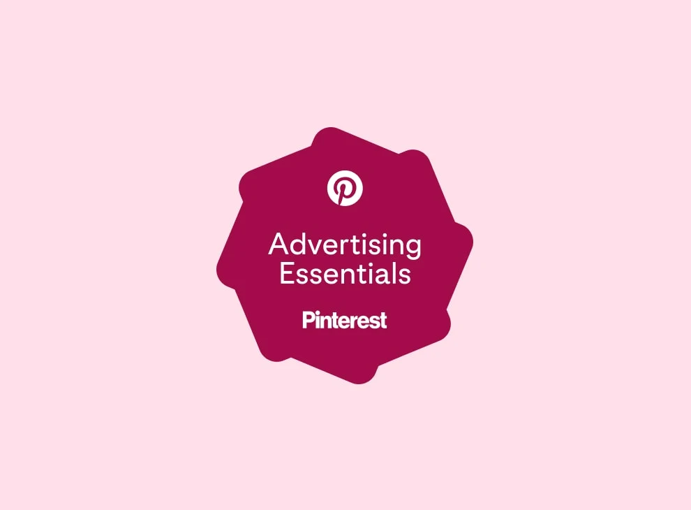 A plum-colored celebratory badge featuring the text "Advertising Essentials" and the Pinterest logo.