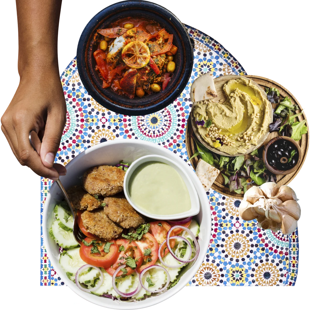 Collage of aerial views of middle-eastern food. Bowl with falafel patties, cucumber and tomato slides, onions and basil with a smaller bowl of sauce on the left. Bowl at right with pita bread, salad and hummus. Bowl at top with a tomato and corn stew.
