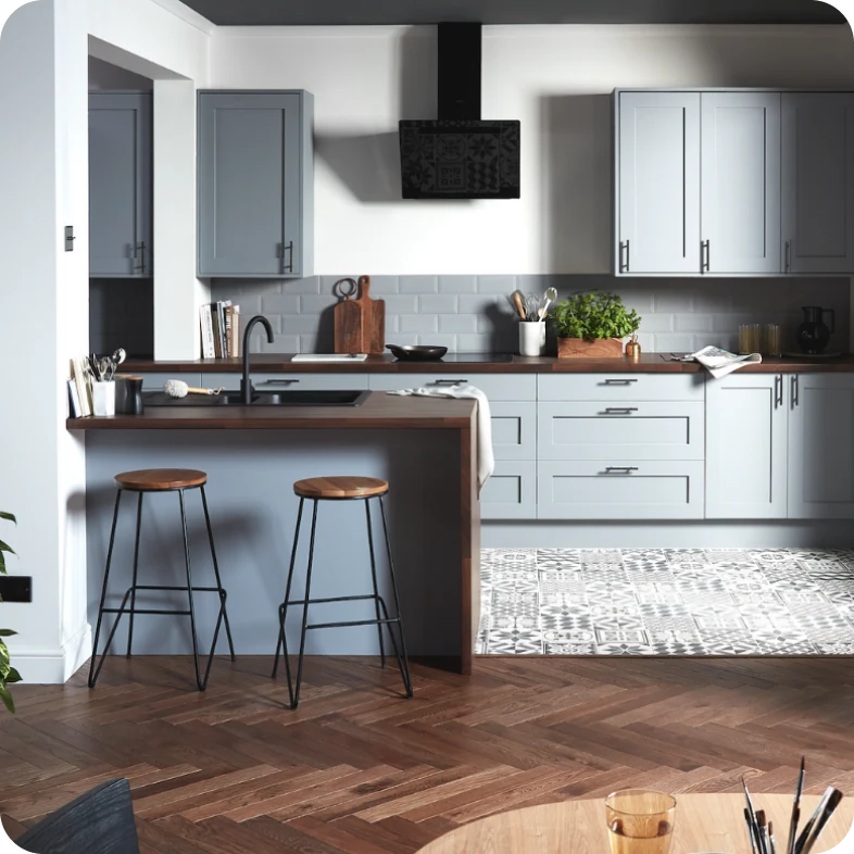 Grey kitchen with chevron flooring