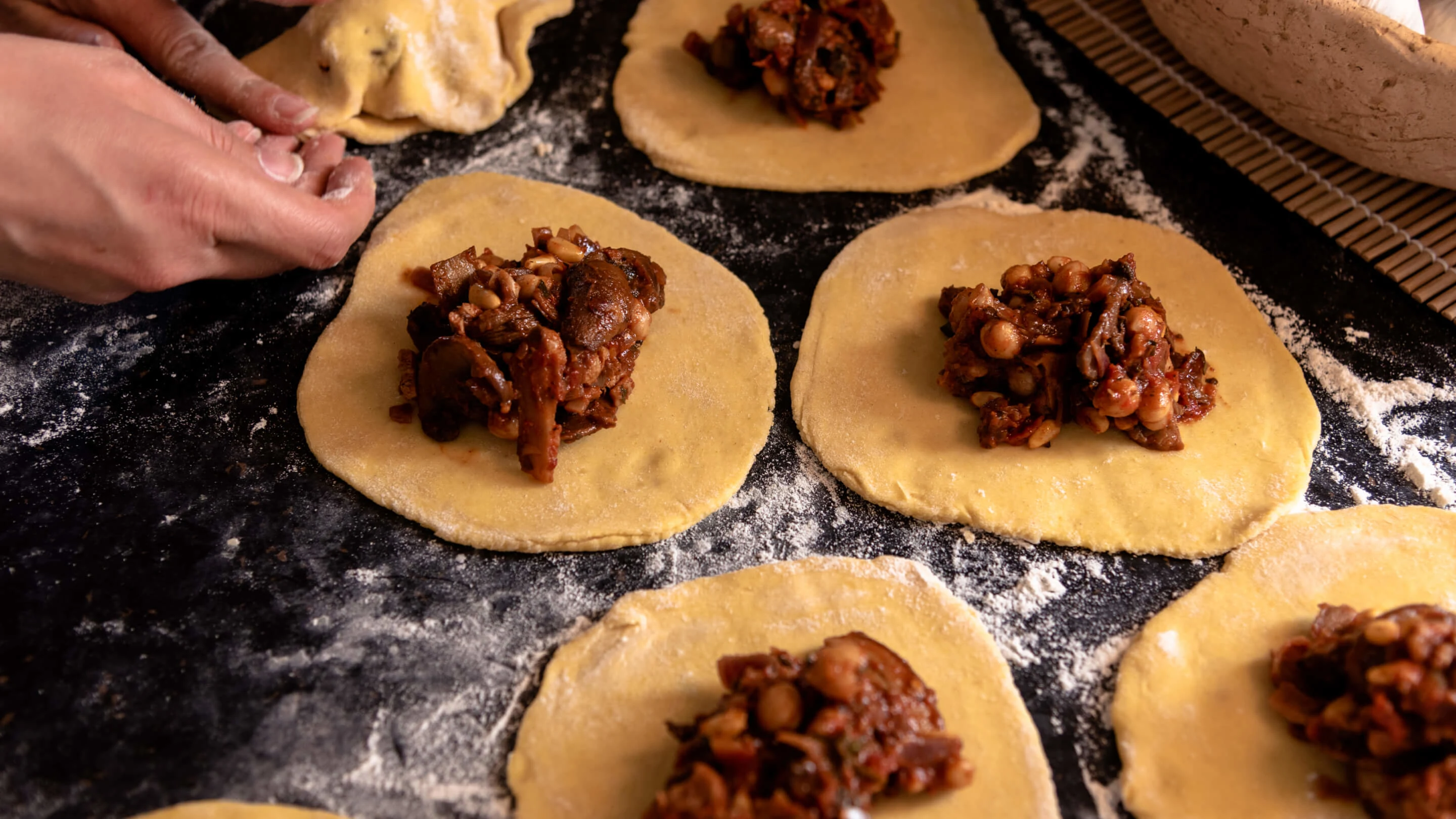 Preparing pastry with meat and chickpeas. 