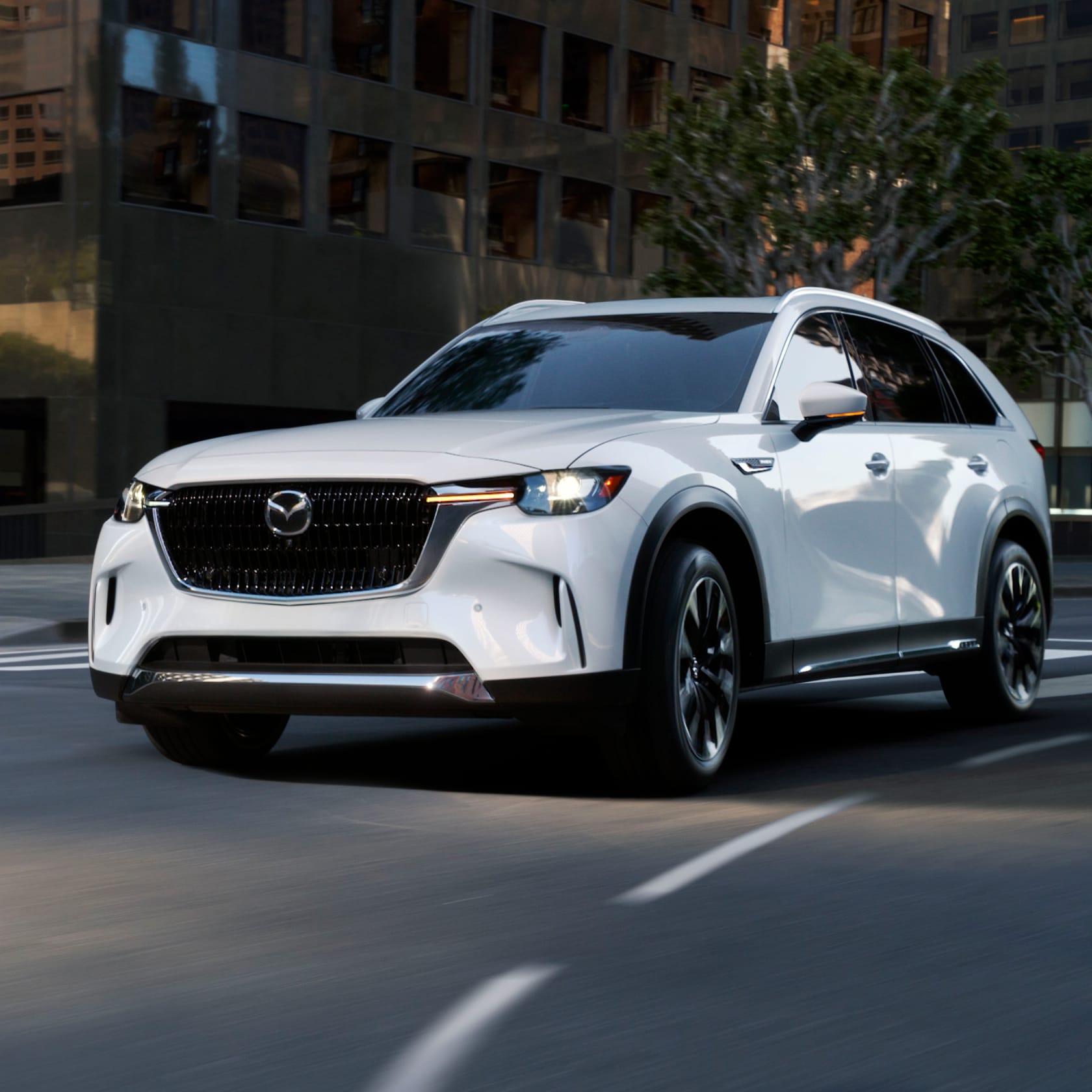 White car driving in an urban area