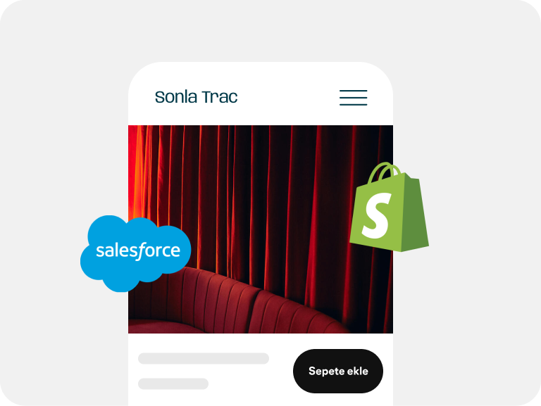 Etrafında Salesforce ve Shopify logoları bulunan kırmızı bir koltuk reklamı.