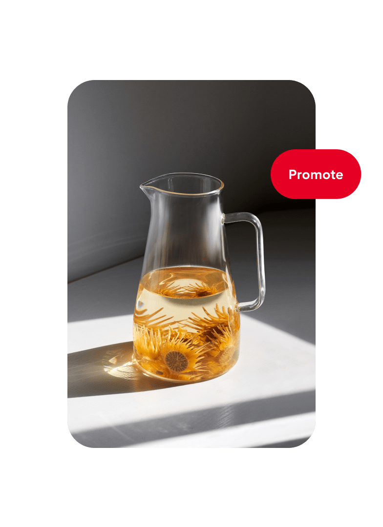 Pin of a glass pitcher filled halfway with water and orange flowers with a “Promote” button on the right.