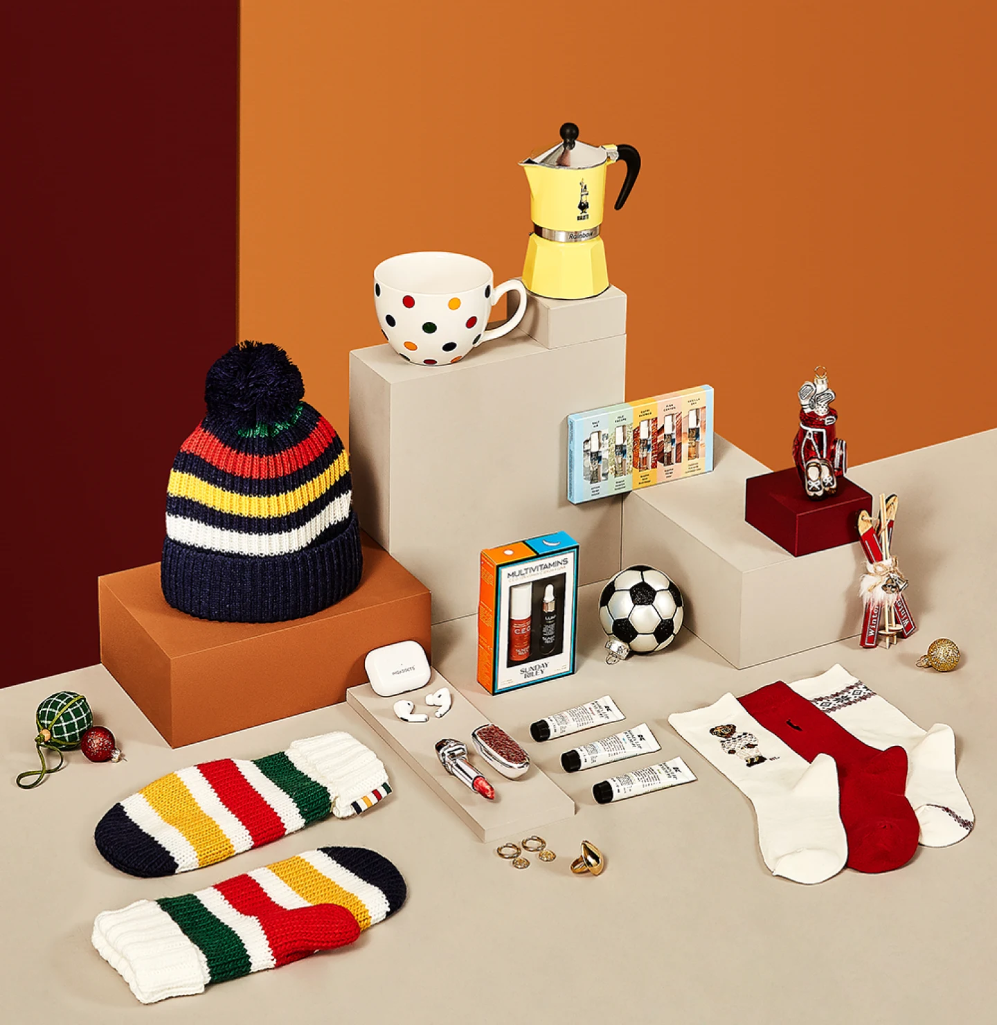 Display of products sold by the retailer, including socks, a beanie, vintage sports memorabilia, tech products and beauty products.