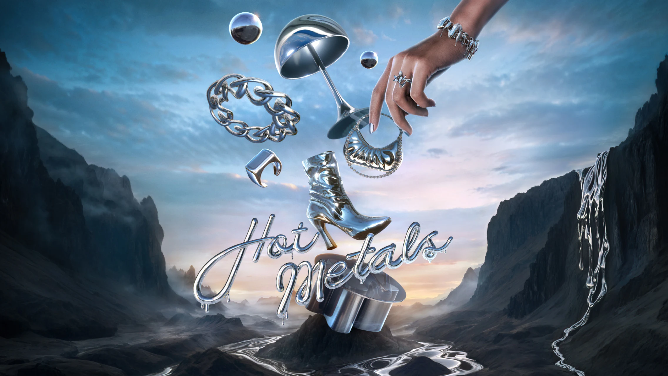 Various chrome objects such as heeled bootie, lamp, bracelet and handbag are centered in a moody canyon with a hand emerging from top right frame. “Hot metals” is spelled out in center in drippy chrome font. 