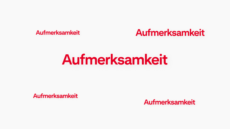 Eine Animation des Wortes „Aufmerksamkeit“, die in verschiedenen Teilen des Bildes aufblinkt.