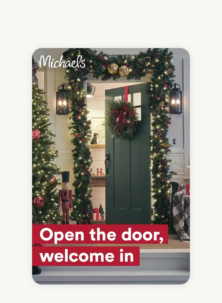 A Michael’s ad shows the front of a house decorated in Christmas lights, a garland and a wreath