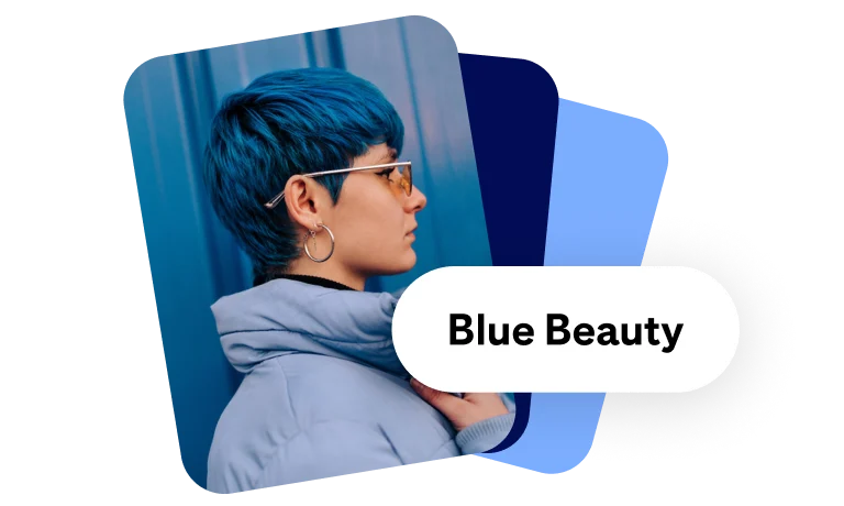 Ein Pin-förmiges Bild, auf dem eine weiße Frau mit kurzen, blauen Haaren in einer blauen Daunenjacke und mit Sonnenbrille abgebildet ist. Dahinter befinden sich zwei weitere Formen und davor ein weißes Suchfeld mit dem Text „Blue Beauty“.