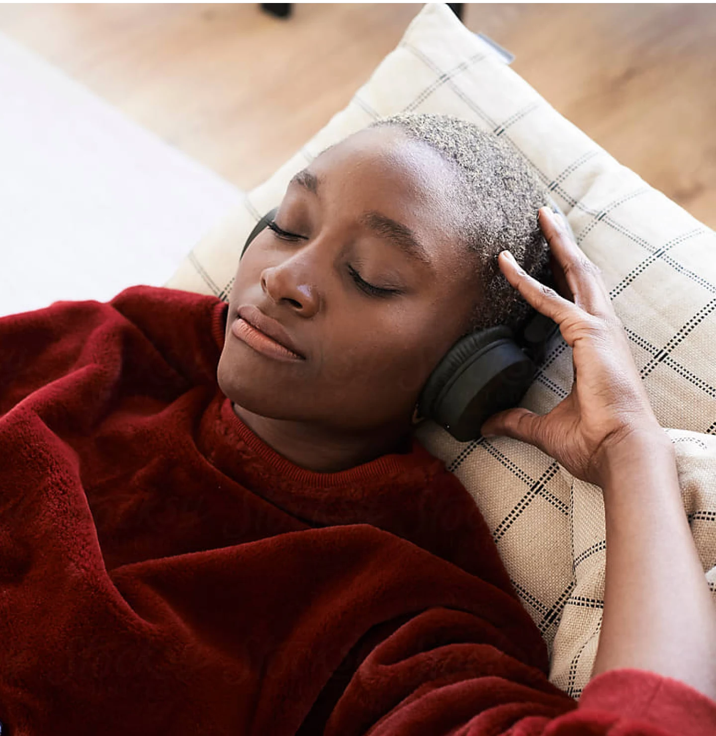 Black woman listening to music while reclining