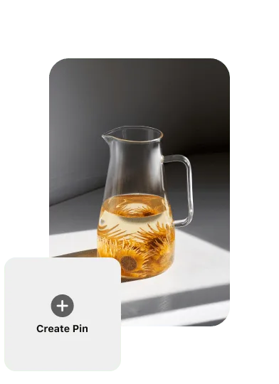 Pin of a glass pitcher filled halfway with water and orange flowers, and a ‘Create Pin’ button on the left.