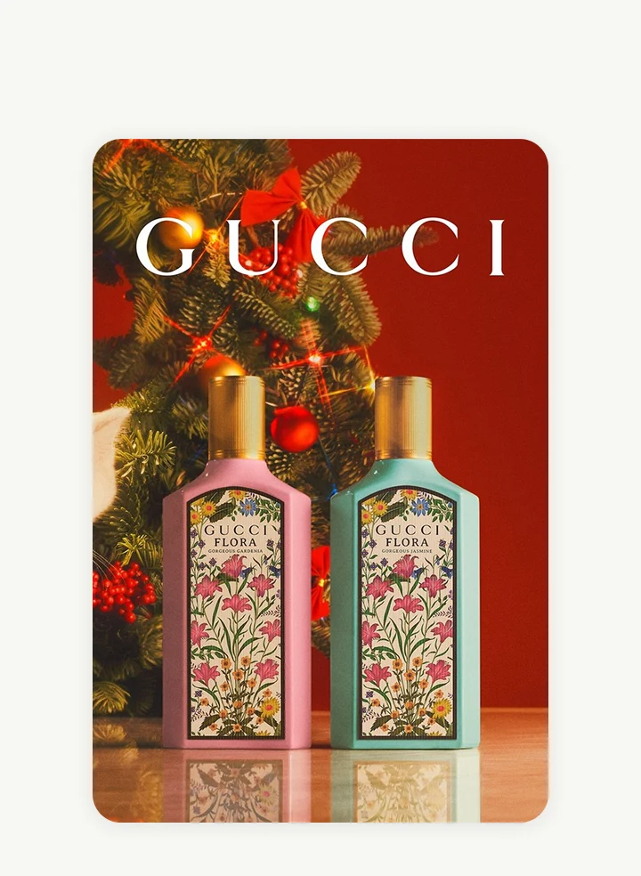 A Gucci ad showcases perfumes against a festive backdrop