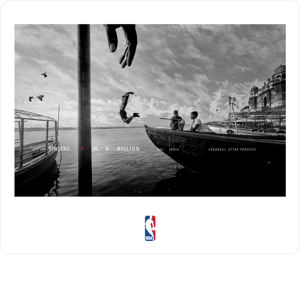 A man jumps from a boat, while others watch.