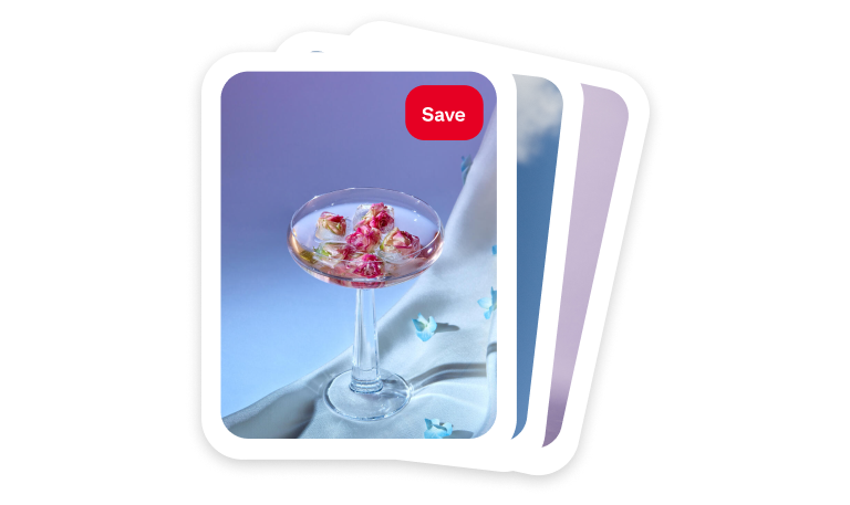 A colorful cocktail sits on white linen against a purple backdrop 