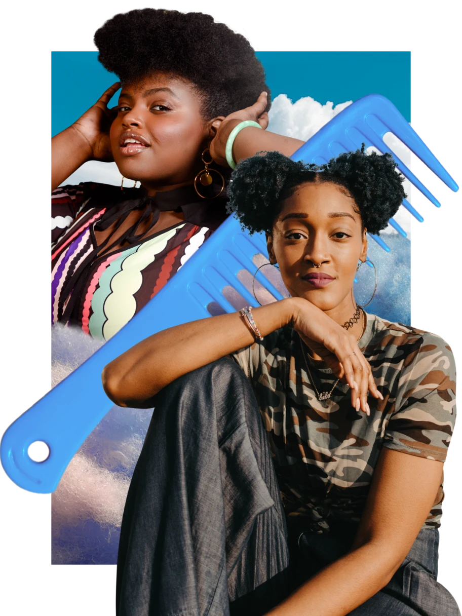 Black woman at right with two natural hair puffs looks at camera, arm propped on her leg. Black woman at left holds her hands to her natural hair. Large blue comb in the middle. Blue sky with white clouds in the background.
