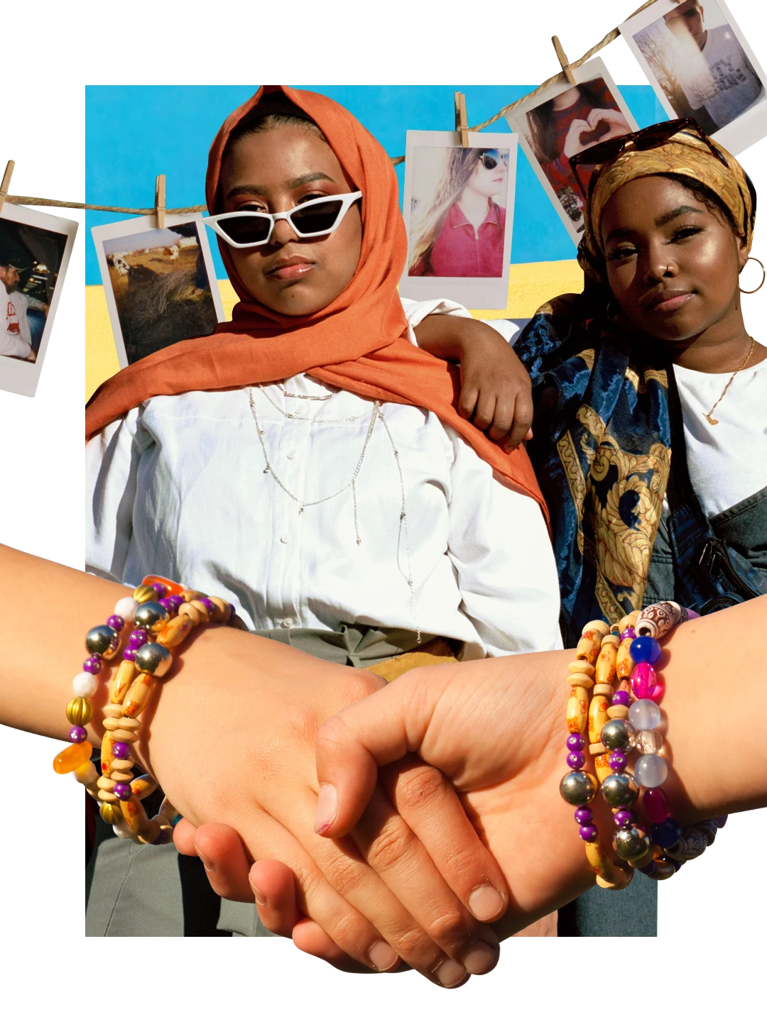 Hands with bracelets and rings slip into each other at the bottom. Instant photos on a clothesline at back against a blue and yellow background. Two Black women with head wraps at center, one leaning a hand on the other’s shoulder.
