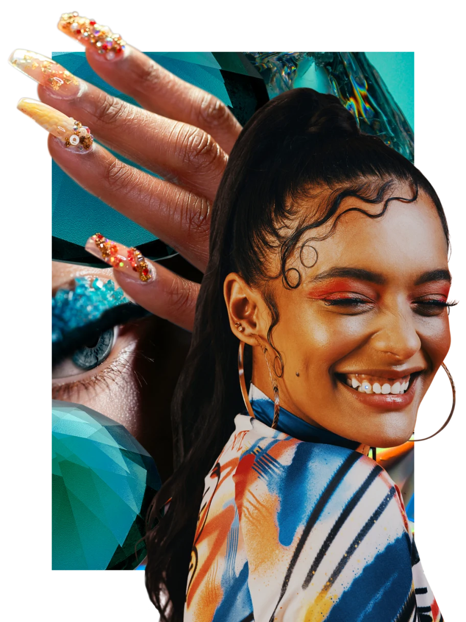 Woman with bright red eye makeup and top ponytail smiles, eyes closed. Woman with sparkly blue eye makeup. Black hand with colorful bejeweled fingernails.