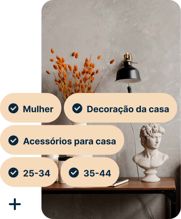 A Pin showing a desk with a vase of orange flowers, a black lamp and a bust of Michelangelo’s David with the search terms Women, Home decor, Home accessories, 25 to 34 and 35 to 44