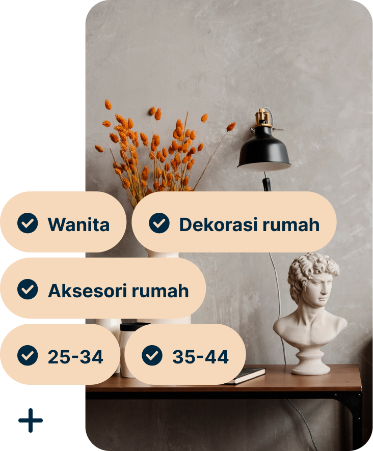 A Pin showing a desk with a vase of orange flowers, a black lamp and a bust of Michelangelo’s David with the search terms Women, Home decor, Home accessories, 25 to 34 and 35 to 44