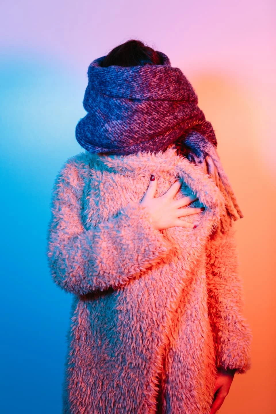 Lady covering face with a scarf
