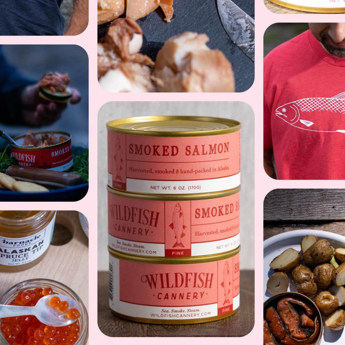 Stacked pink cans of Wildfish Cannery smoked salmon. Hand holds salmon and a cucumber slice on a cracker. An open can of smoked salmon. Salmon and caviar pieces on a table. Plate with roasted potatoes. White man wears a red t-shirt with a fish drawing.