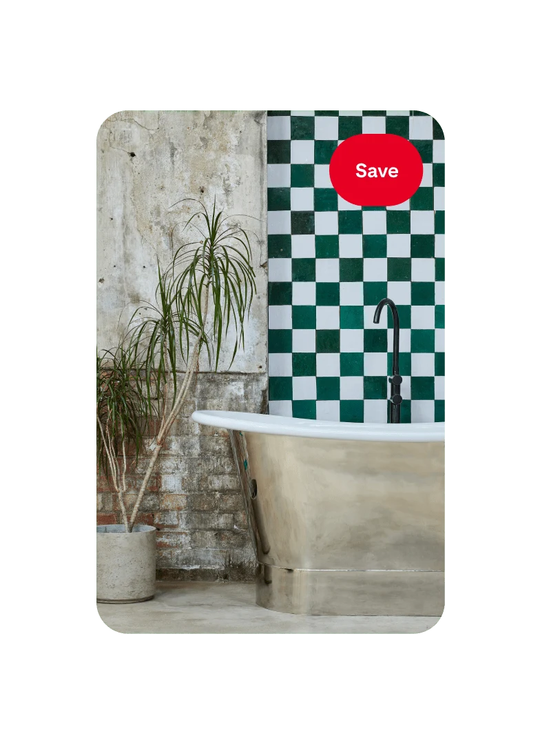 Pin featuring a focused view of a bathroom decorated with a palm plant in a cement pot and a metallic bath against a chequered wall, with a red ‘Save’ button in the top right-hand corner.