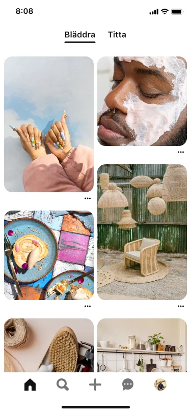 Mobilvy av startflödet med en mängd olika pins som ett par bruna händer som visar upp nagelkonst, en svart man med ansiktsmask, tallrikar med mat och utomhusinredning.